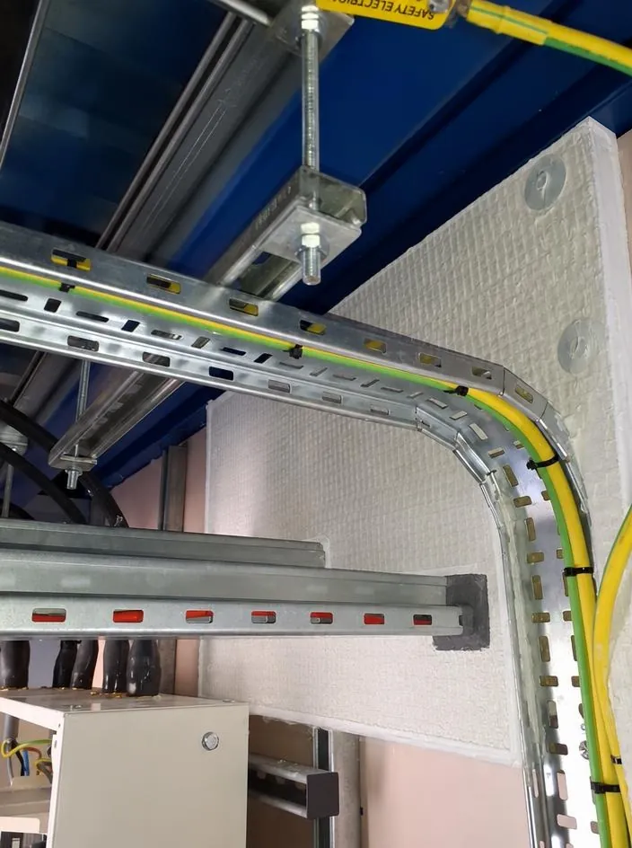 Cable tray passing through a fire-resisting wall, sealed with fire stopping